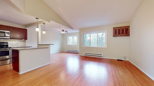 kitchen with tasteful backsplash, stainless steel appliances, a baseboard heating unit, light hardwood / wood-style flooring, and hanging light fixtures