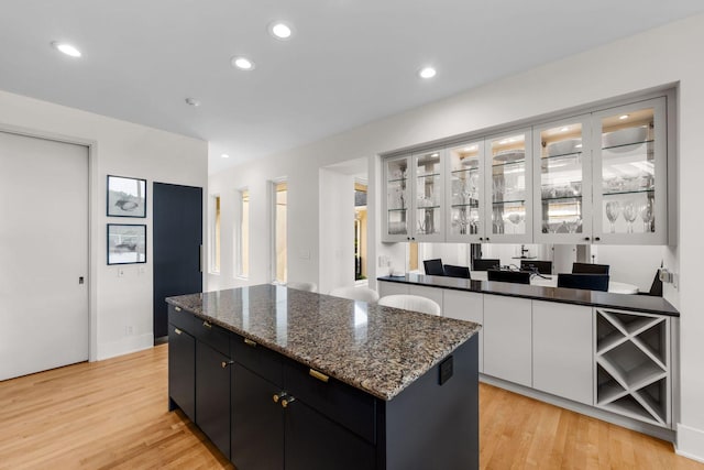 17680 Bearpath Trl, Eden Prairie, MN 55347 - bar area featuring light wood finished floors and recessed lighting