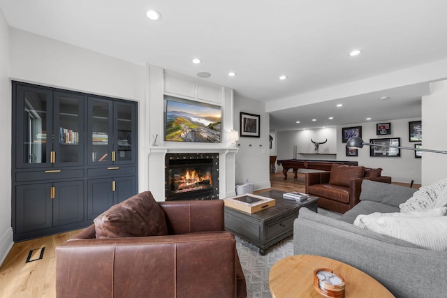 17680 Bearpath Trl, Eden Prairie, MN 55347 - living room featuring light wood finished floors, recessed lighting, a fireplace, and billiards