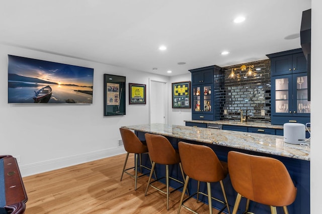 17680 Bearpath Trl, Eden Prairie, MN 55347 - indoor wet bar featuring light wood-style flooring and recessed lighting