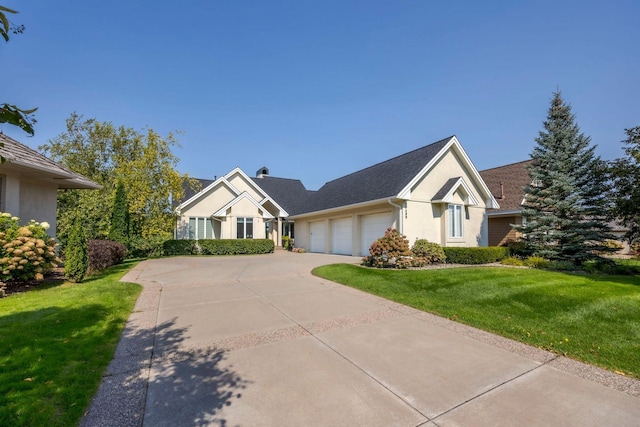 17680 Bearpath Trl, Eden Prairie, MN 55347 - view of front of home with a garage, stucco siding, a front lawn, and driveway