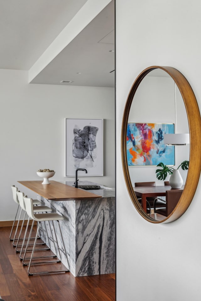 room details featuring sink and hardwood / wood-style flooring