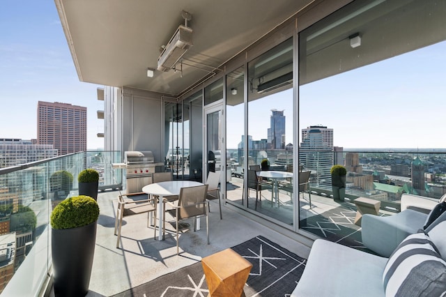 balcony featuring area for grilling