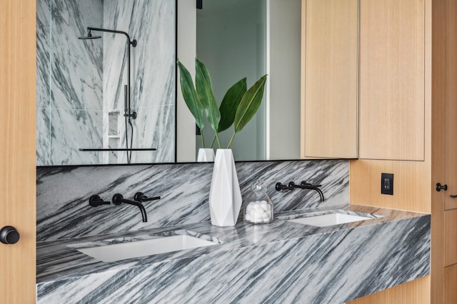 interior details with walk in shower, decorative backsplash, and vanity