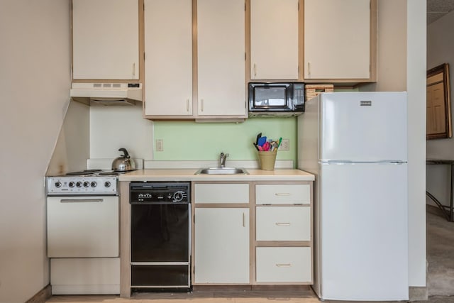 kitchen featuring black appliances and sink