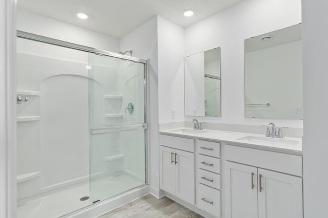 bathroom with vanity and walk in shower