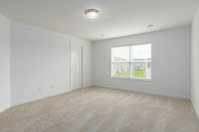 unfurnished room with carpet flooring