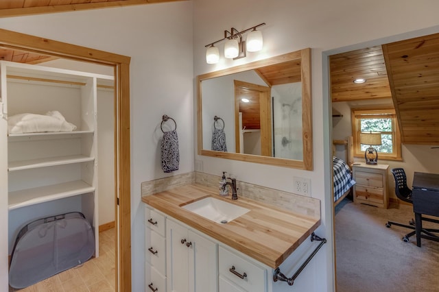 bathroom with wood-type flooring, lofted ceiling, wooden ceiling, and vanity