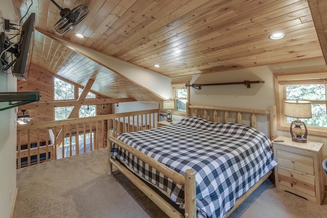 carpeted bedroom with multiple windows, wood ceiling, and vaulted ceiling