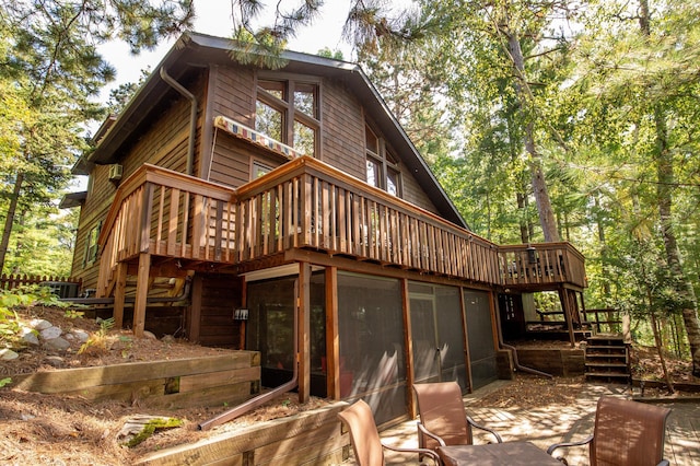 8607 Nottingham Rd, Lake Shore, MN 56468 - back of house featuring central AC unit, a wooden deck, a patio area, stairs, and a sunroom