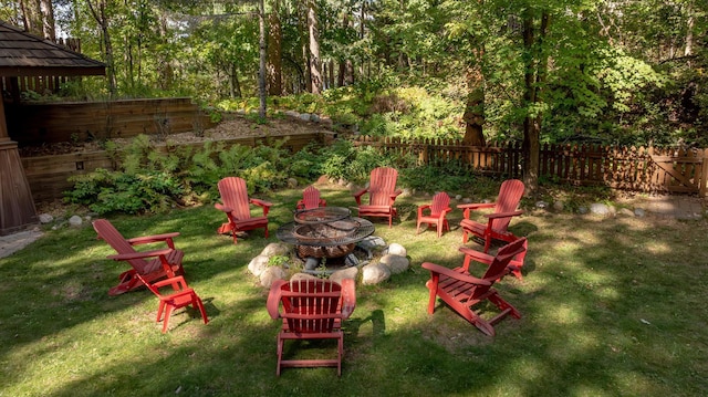 view of yard with an outdoor fire pit