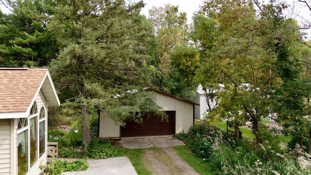 39534 92nd Ave, Onamia, MN 56359 - view of front of house with an outdoor structure, a shingled roof, and a garage