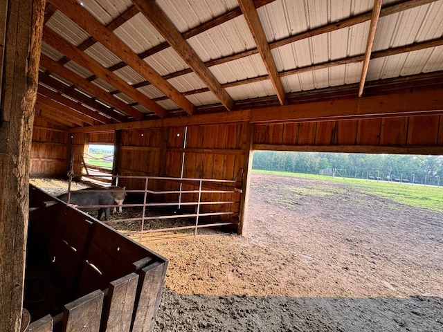 view of horse barn featuring a rural view