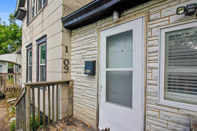 view of exterior entry with stone siding