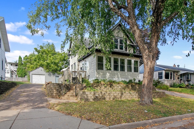 view of front of house featuring an outdoor structure and a garage