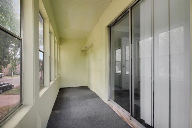 unfurnished sunroom with plenty of natural light