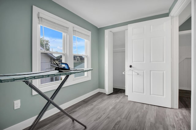 exercise room with hardwood / wood-style flooring