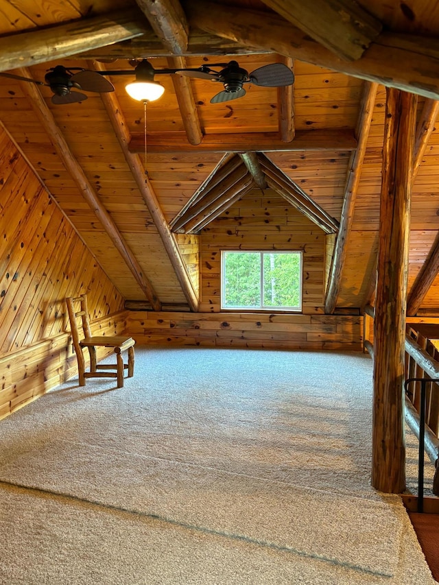 additional living space featuring wood walls, carpet flooring, ceiling fan, and wooden ceiling