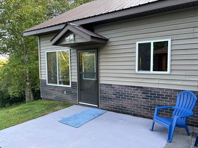 property entrance with a patio area