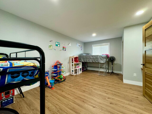 recreation room with light wood-type flooring