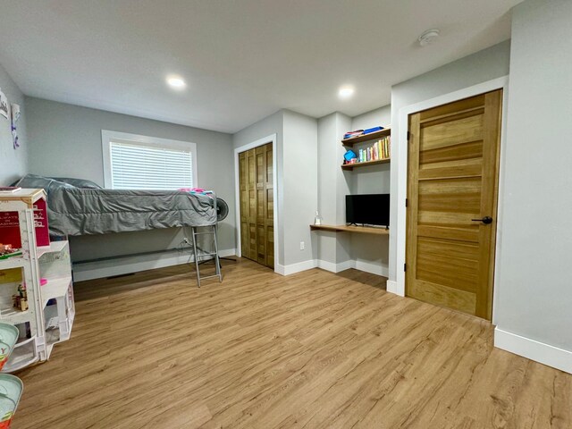 bedroom with light hardwood / wood-style floors