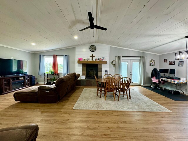 living room featuring a tile fireplace, wooden ceiling, light hardwood / wood-style floors, lofted ceiling, and ceiling fan