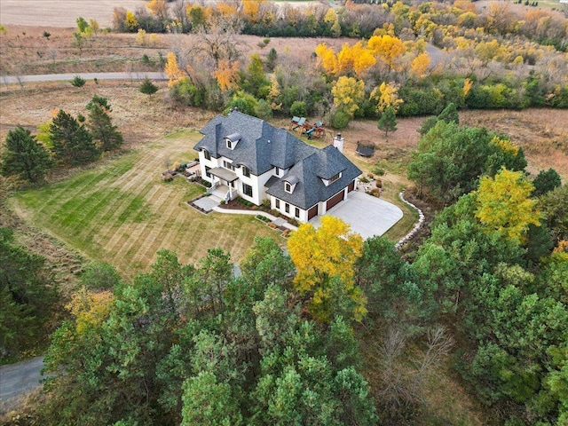 birds eye view of property with a rural view