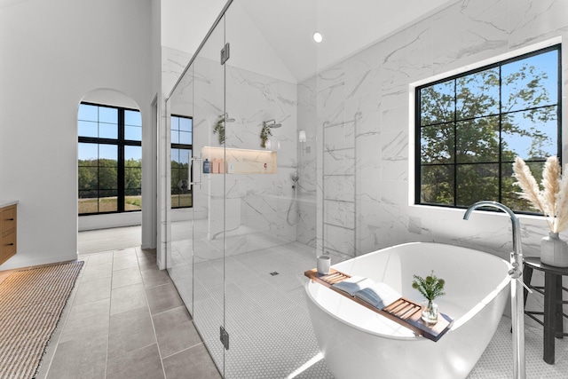 21236 Crescent Curv, Credit River Twp, MN 55044 - bathroom with lofted ceiling, a soaking tub, a marble finish shower, and recessed lighting