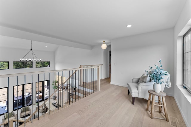 21236 Crescent Curv, Credit River Twp, MN 55044 - living area with visible vents, baseboards, recessed lighting, a notable chandelier, and wood finished floors