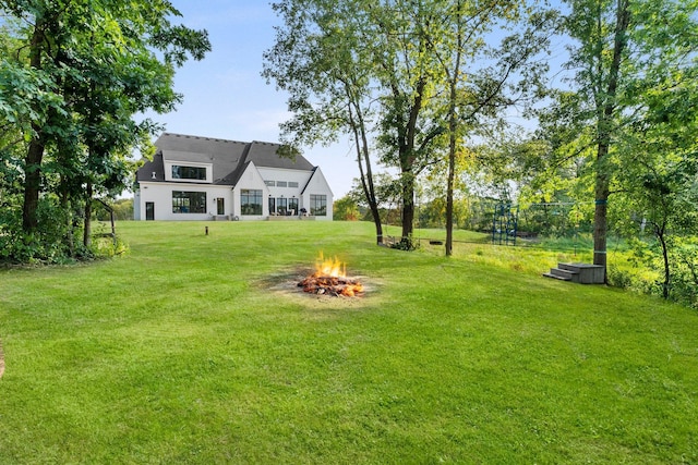 21236 Crescent Curv, Credit River Twp, MN 55044 - view of yard featuring an outdoor fire pit