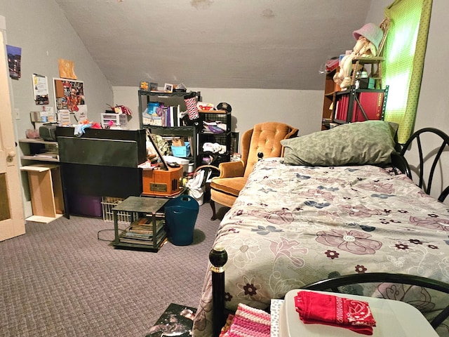 bedroom featuring lofted ceiling and carpet flooring