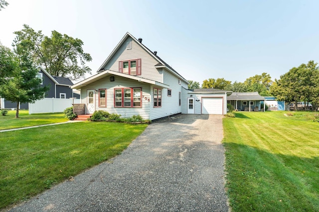 view of front of home featuring a garage and a front lawn