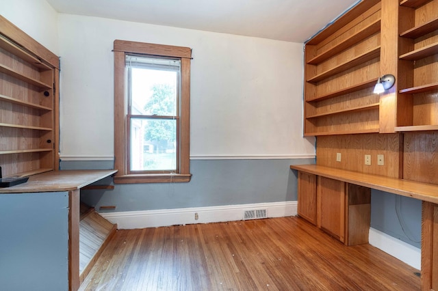 unfurnished office with light wood-type flooring