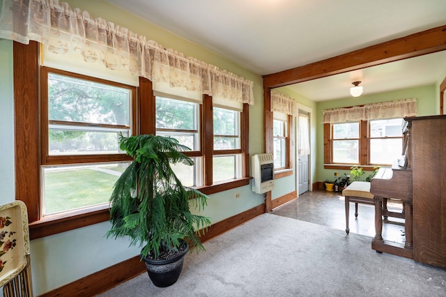 interior space featuring a wealth of natural light and heating unit