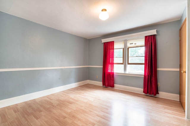 unfurnished room featuring light hardwood / wood-style floors