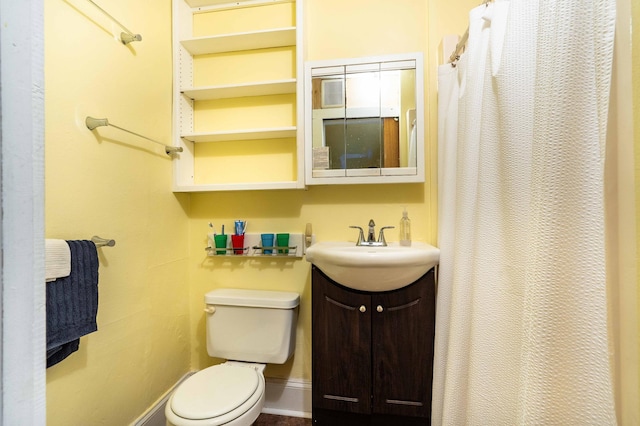 bathroom featuring vanity, toilet, and a shower with shower curtain