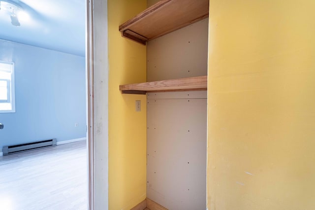 closet featuring a baseboard radiator