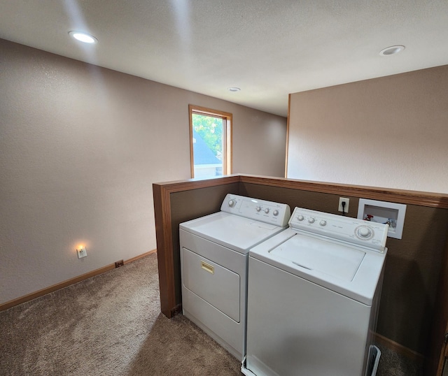 laundry area featuring light colored carpet and washing machine and dryer