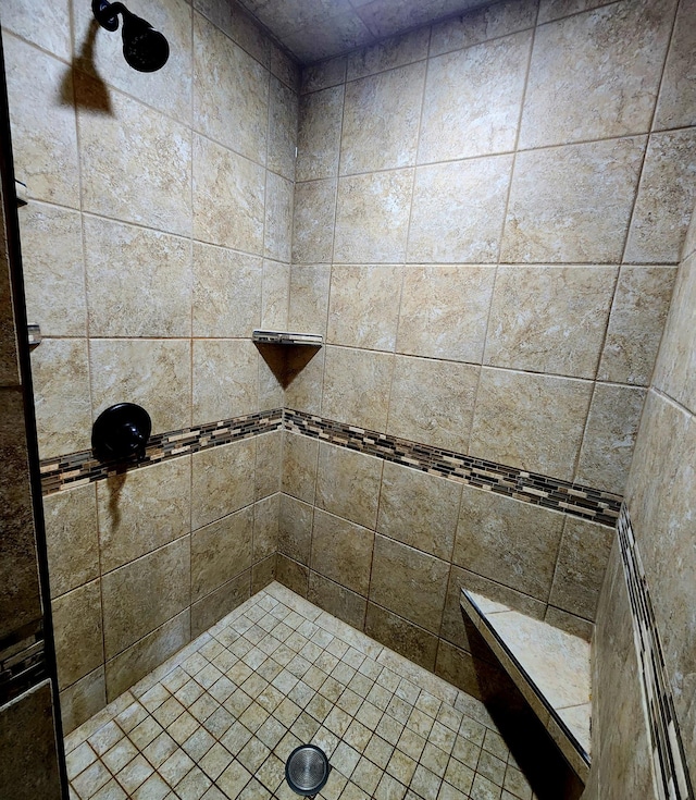 bathroom with tiled shower