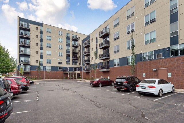 view of property featuring uncovered parking