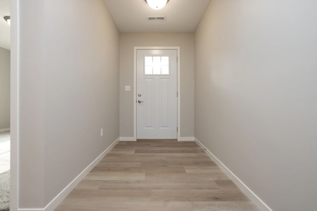 doorway to outside featuring light wood-type flooring