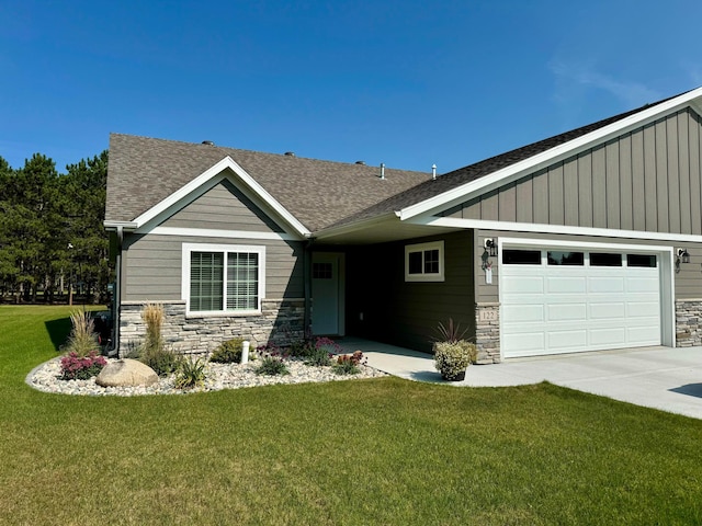 craftsman-style home featuring a garage and a front yard