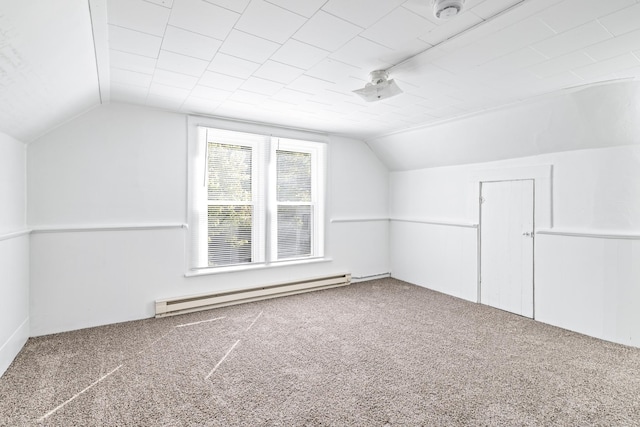 bonus room with vaulted ceiling, baseboard heating, and carpet flooring