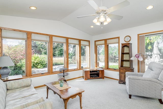 carpeted living room with lofted ceiling and ceiling fan