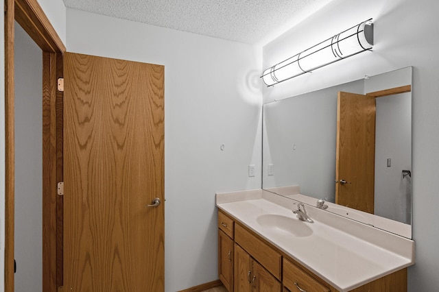 bathroom featuring vanity and a textured ceiling