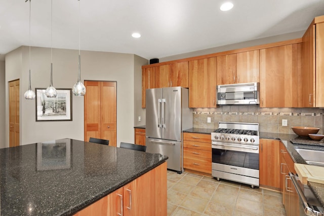 kitchen featuring backsplash, dark stone countertops, decorative light fixtures, light tile patterned floors, and high end appliances