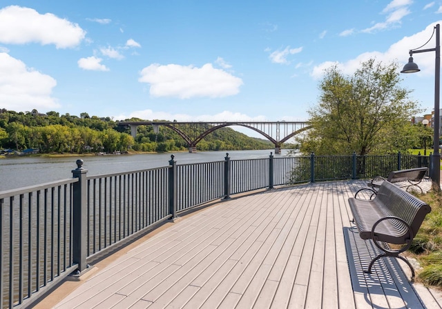 wooden deck featuring a water view