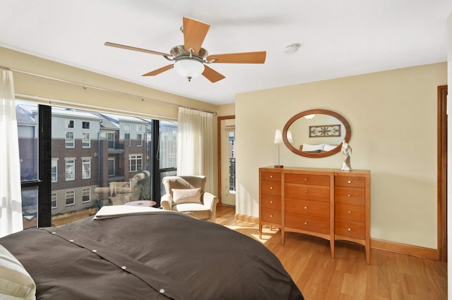 bedroom with ceiling fan and light hardwood / wood-style flooring