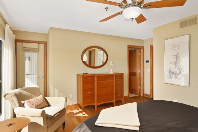 bedroom with wood-type flooring and ceiling fan