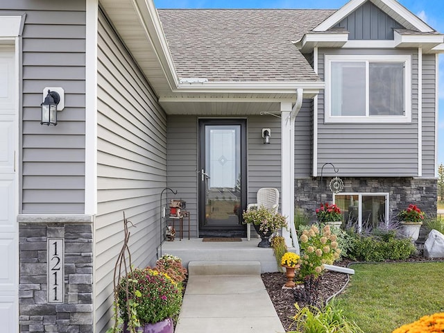 entrance to property with a yard